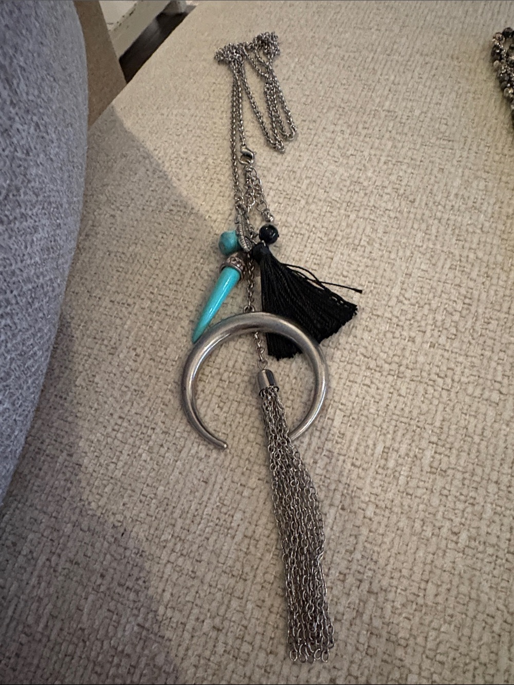 Silver Crescent Pendant Necklace with Turquoise Accent and Black Tassel